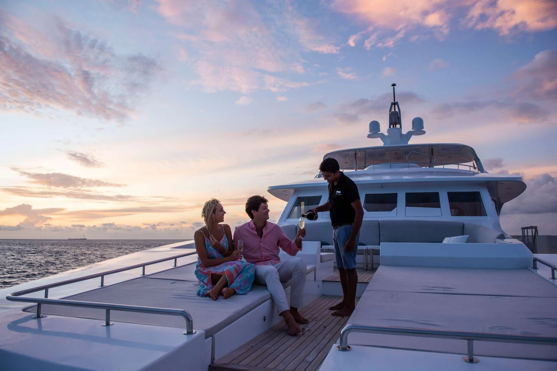 a group of people sitting on a dock on a boat aboard SEAREX Yacht for Sale