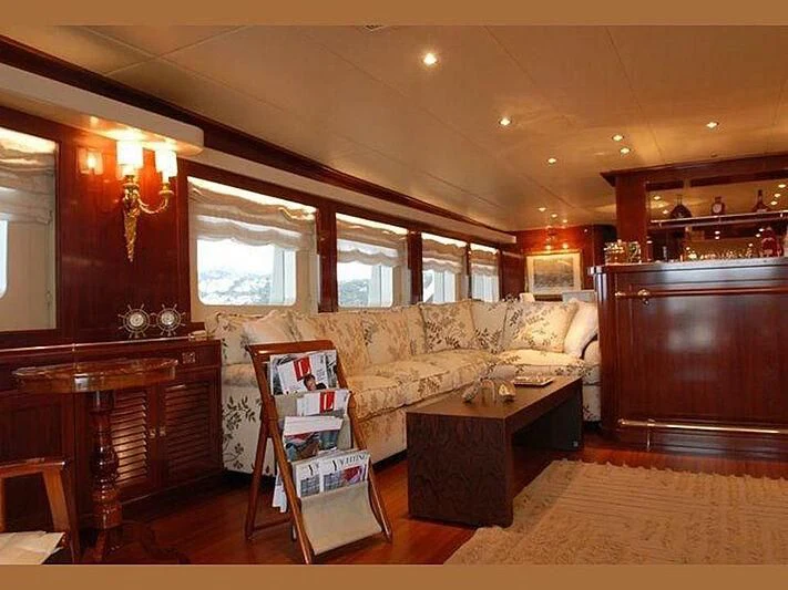 a living room with a bookcase aboard DADDY SHANE Yacht for Sale