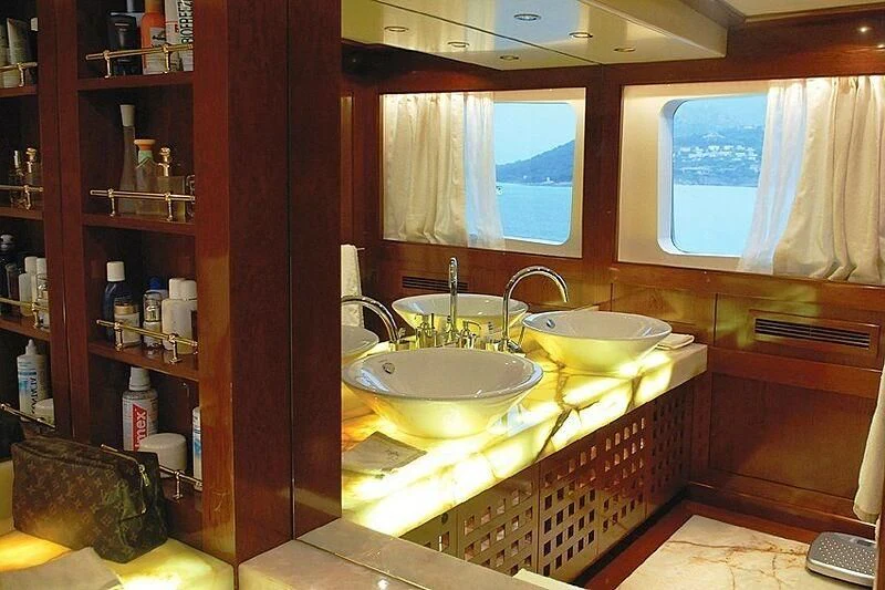 a bathroom with a sink and a mirror aboard DADDY SHANE Yacht for Sale