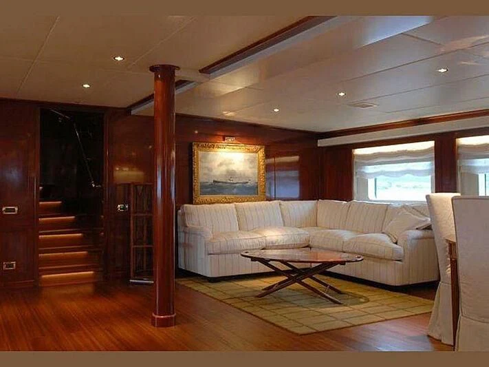 a living room with a wood floor aboard DADDY SHANE Yacht for Sale