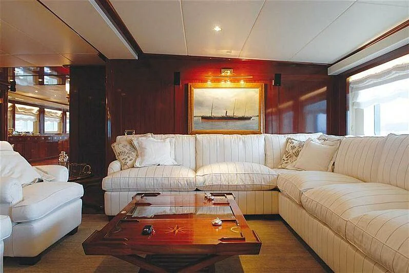 a living room with a couch and a table aboard DADDY SHANE Yacht for Sale