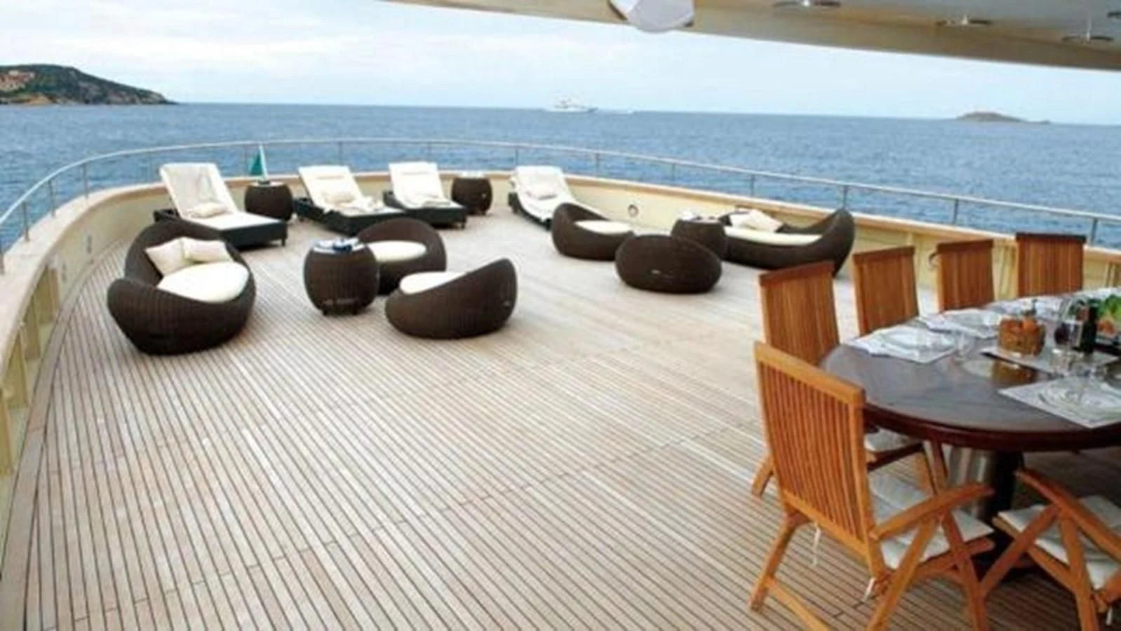 a deck with chairs and tables on it aboard DADDY SHANE Yacht for Sale