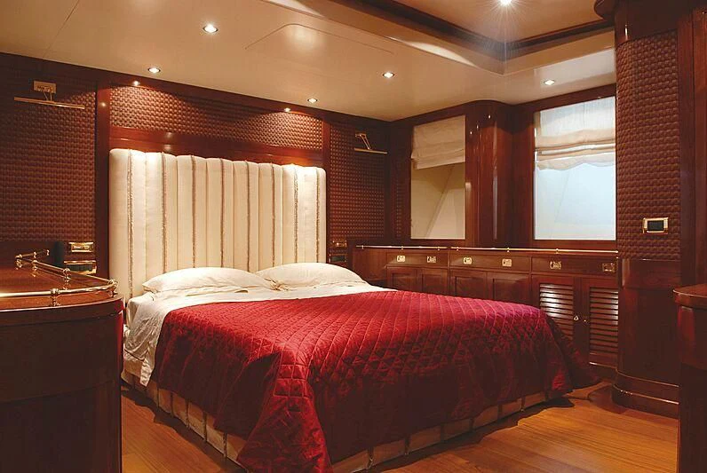 a room with a bed and a window aboard DADDY SHANE Yacht for Sale
