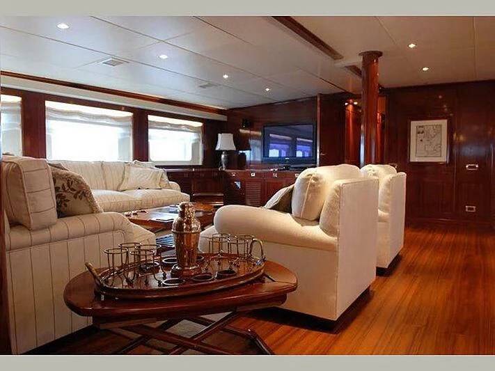 a living room with a couch and a coffee table aboard DADDY SHANE Yacht for Sale