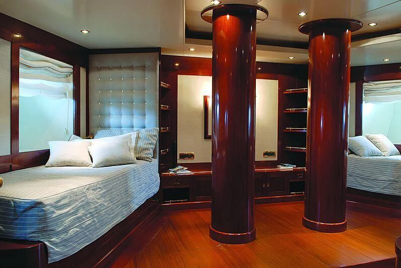 a room with a bed and a lamp aboard DADDY SHANE Yacht for Sale
