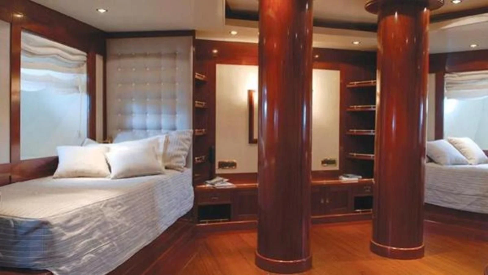 a room with a bed and a mirror aboard DADDY SHANE Yacht for Sale