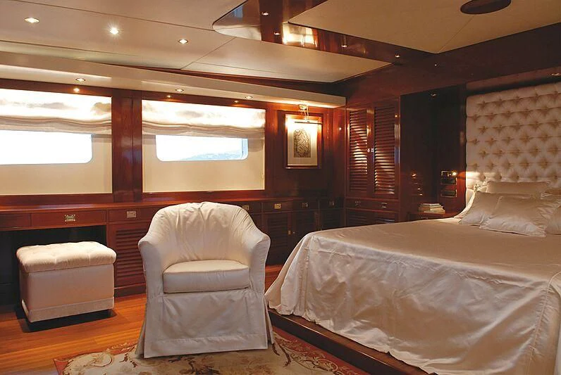 a room with a chair and a bed aboard DADDY SHANE Yacht for Sale