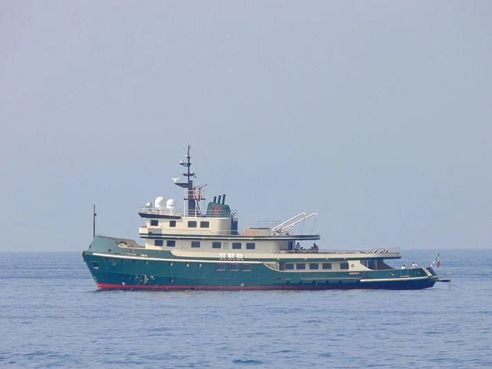 a large blue and red boat on the water aboard DADDY SHANE Yacht for Sale