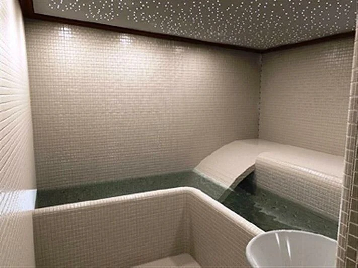 a bathroom with a bathtub and sink aboard DADDY SHANE Yacht for Sale