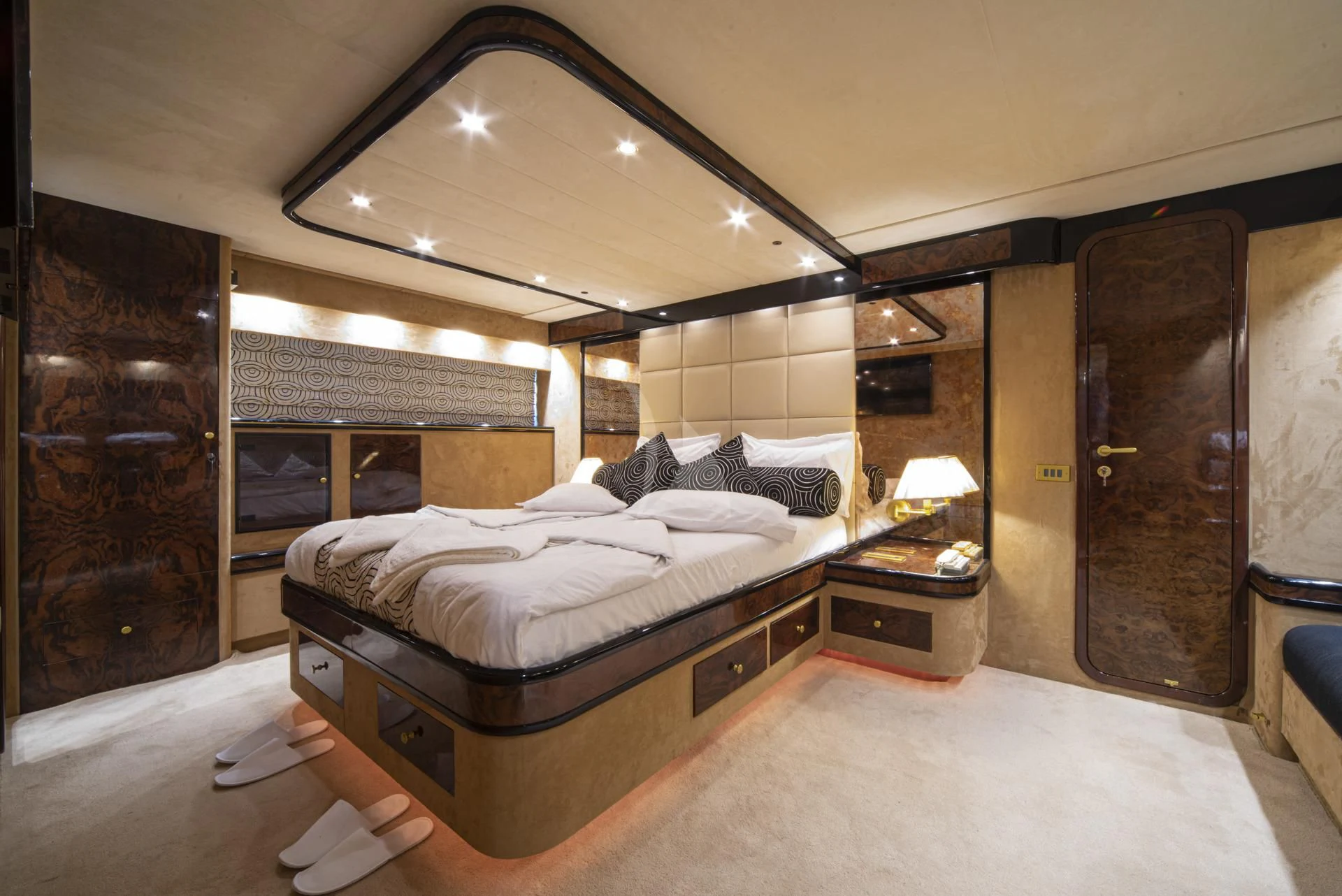 a room with a bed and a mirror aboard WISH Yacht for Sale