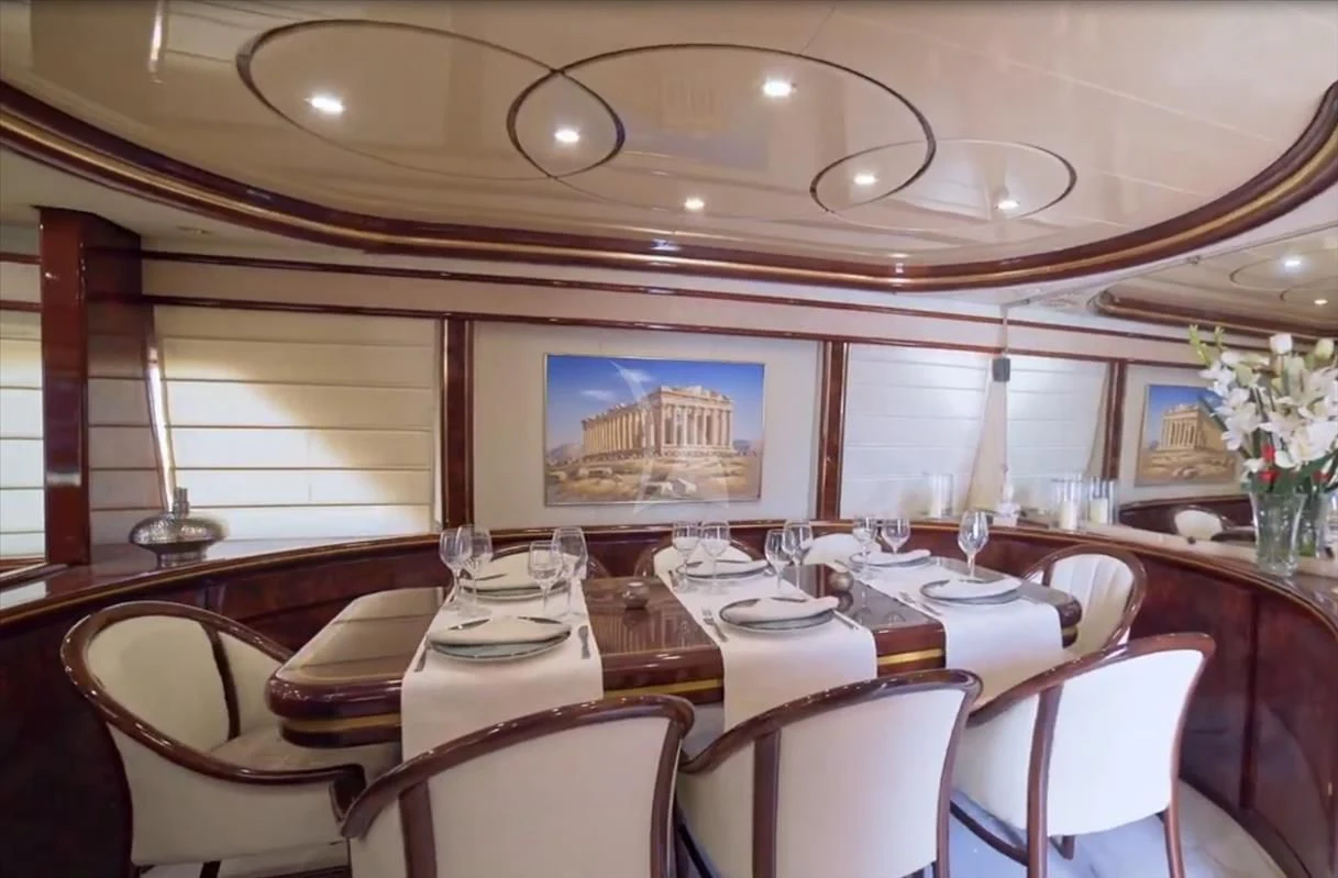 a dining room with a large mirror aboard WISH Yacht for Sale