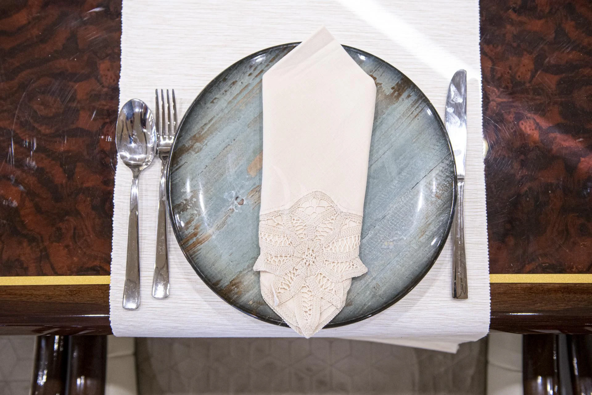a plate with a napkin and fork on it aboard WISH Yacht for Sale