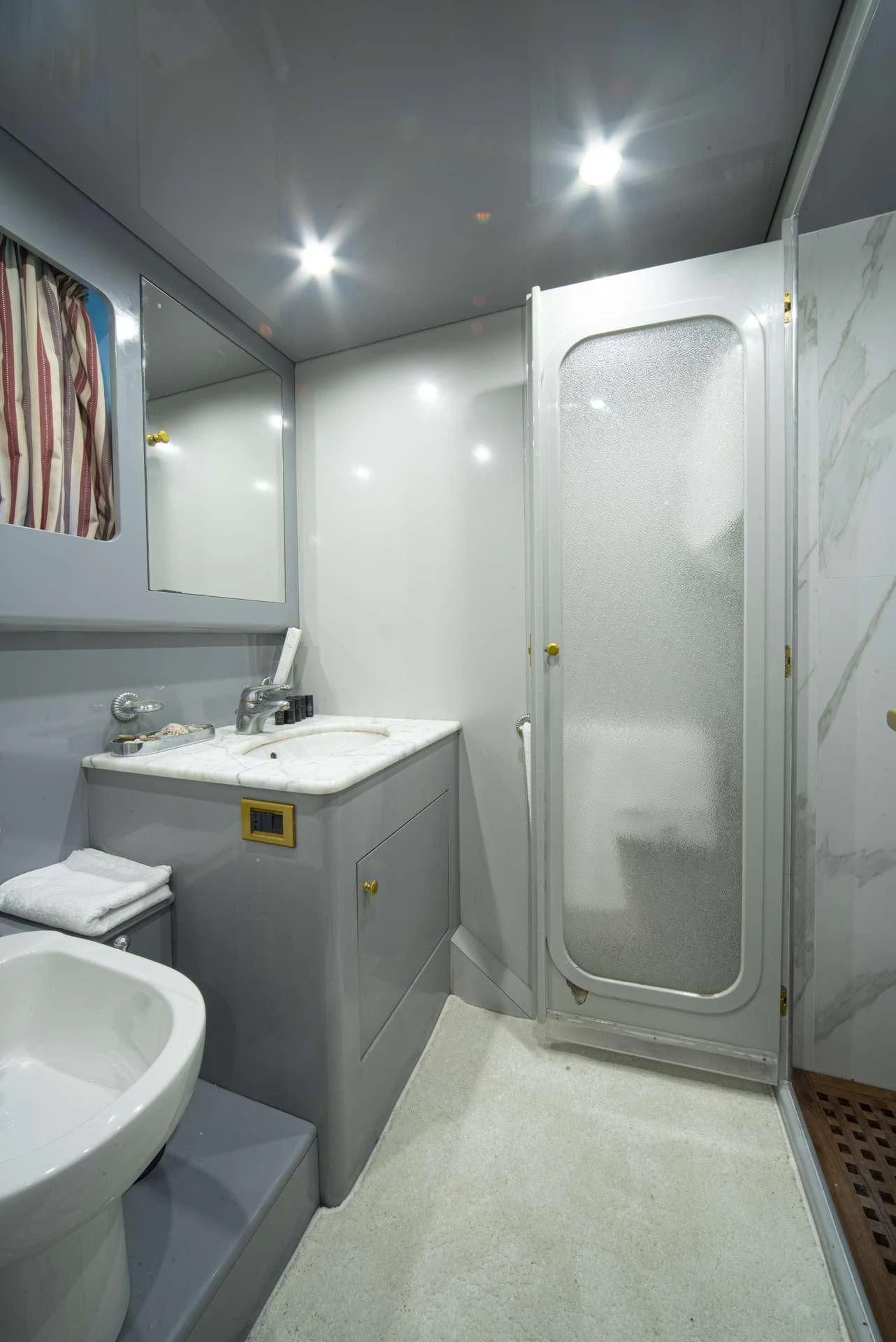 a bathroom with a sink and a shower aboard WISH Yacht for Sale
