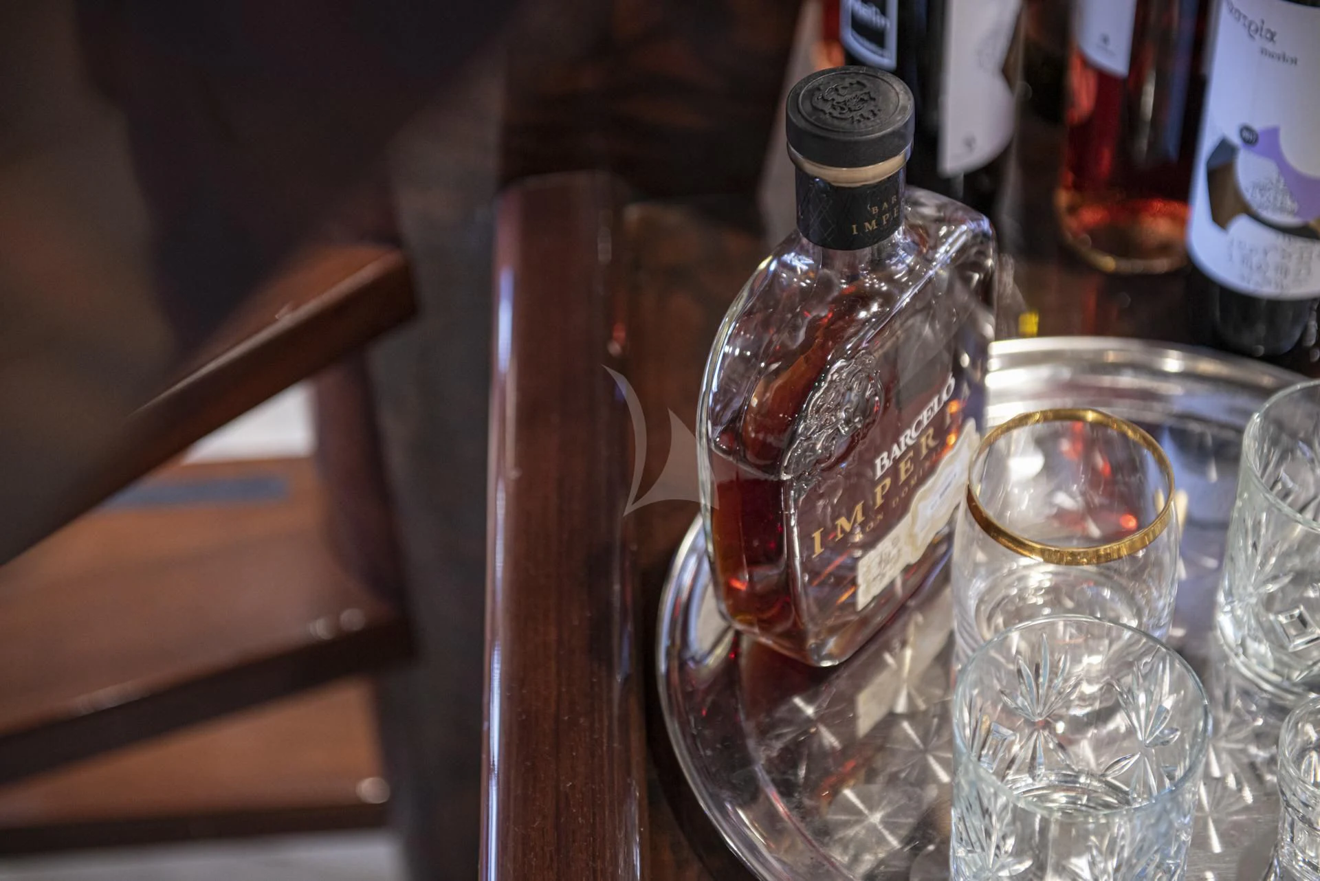 a group of empty liquor bottles aboard WISH Yacht for Sale