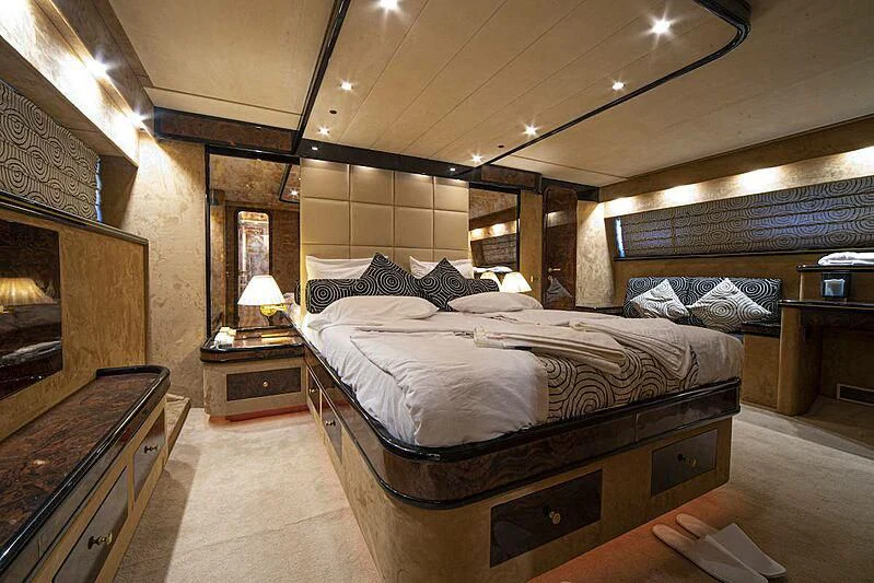 a large bedroom with a large bed aboard WISH Yacht for Sale