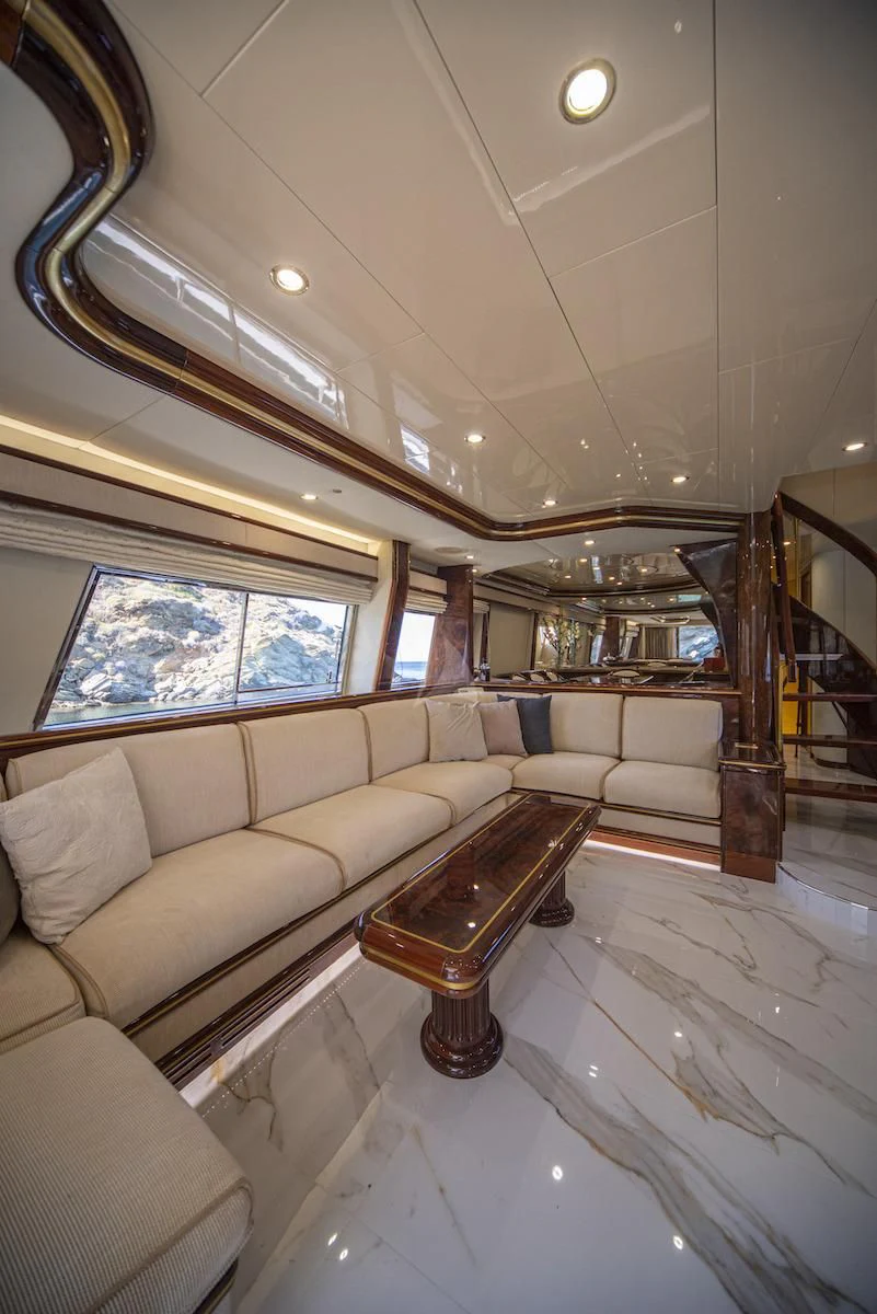 a living room with a large window aboard WISH Yacht for Sale