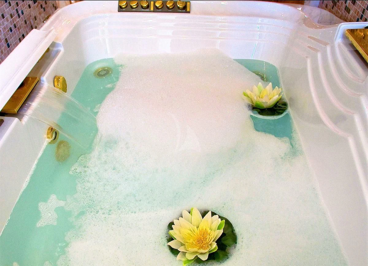 a white plate with a yellow flower on it aboard WISH Yacht for Sale