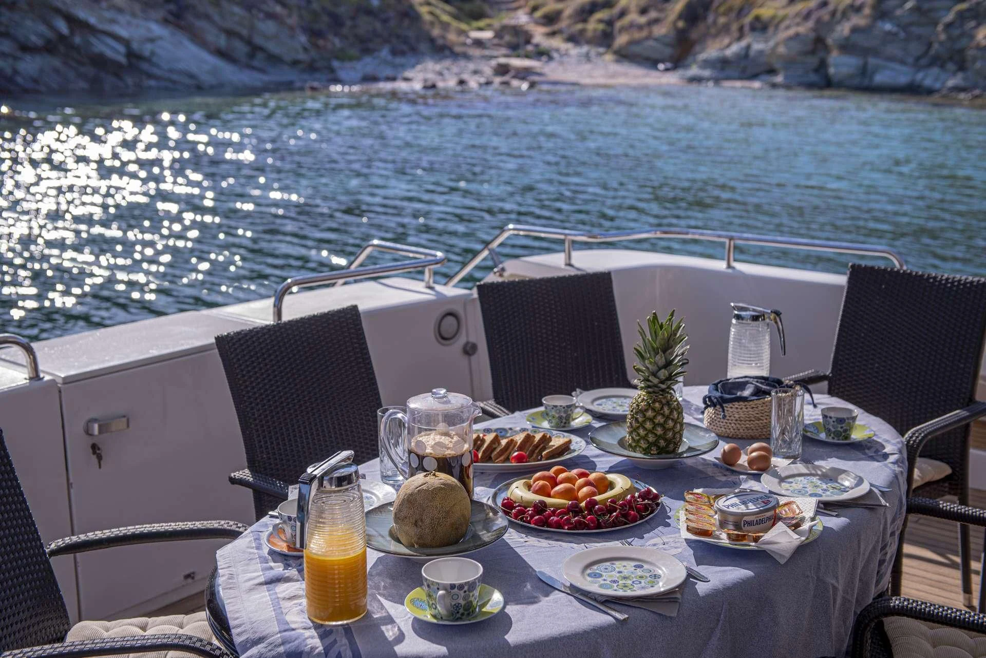 a table with food on it aboard WISH Yacht for Sale