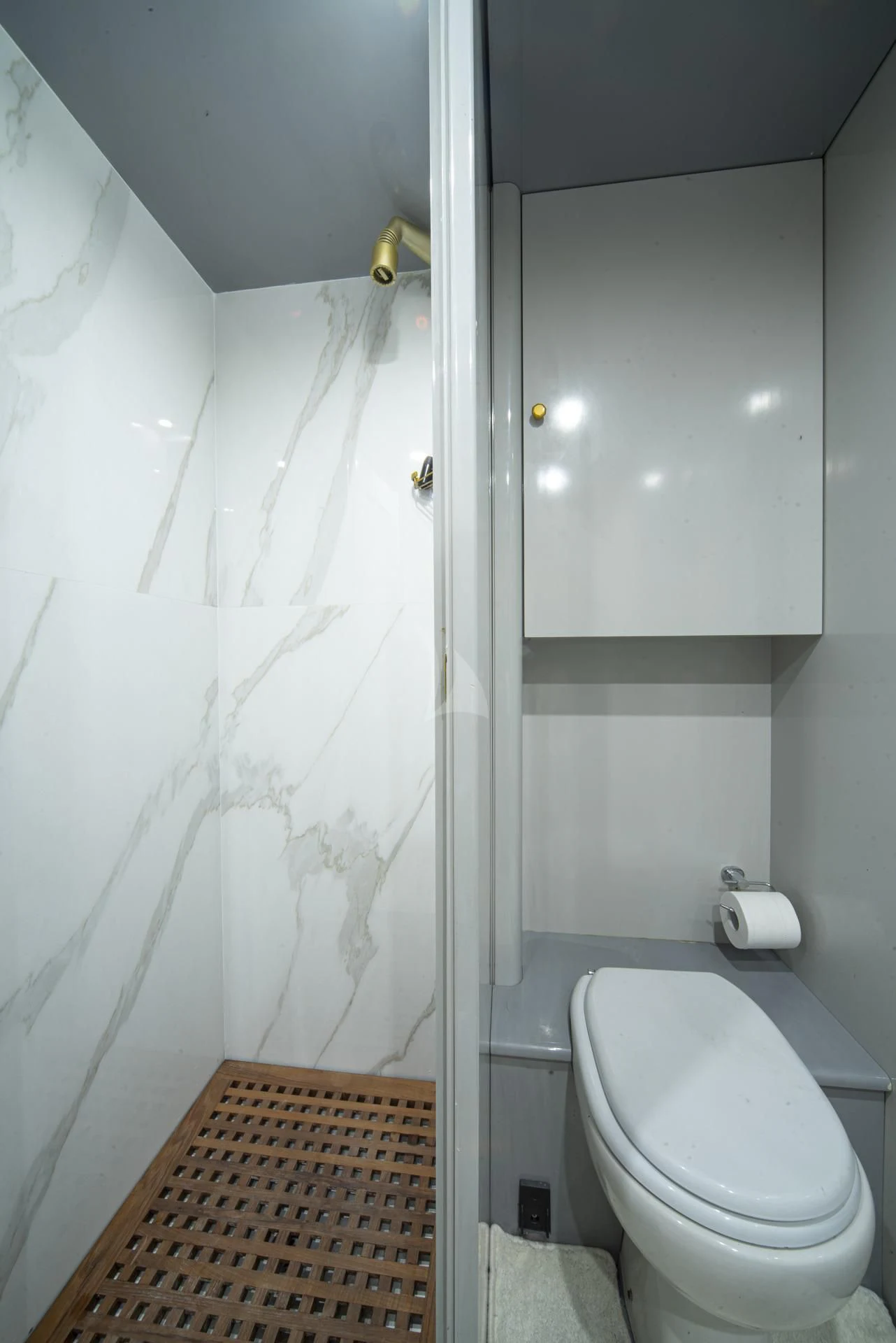 a bathroom with a shower curtain aboard WISH Yacht for Sale