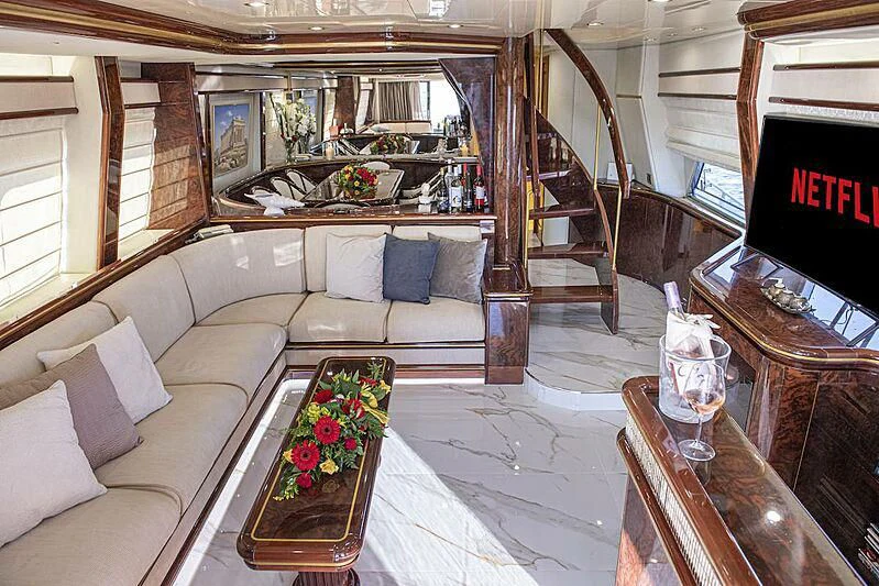 a living room with a couch and a television aboard WISH Yacht for Sale