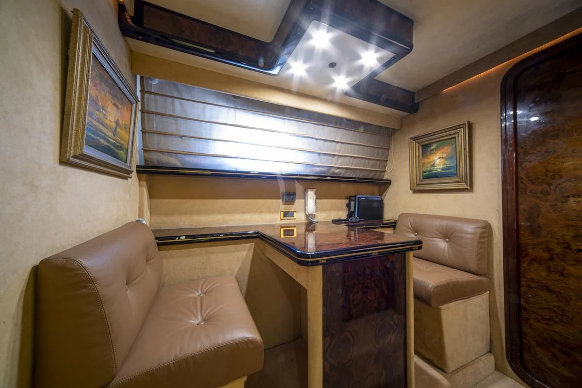 a room with a desk and a couch aboard WISH Yacht for Sale