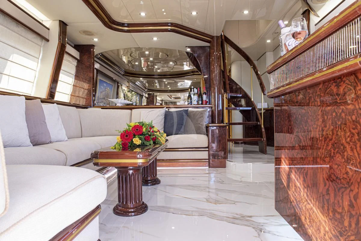 a room with a couch and a table aboard WISH Yacht for Sale