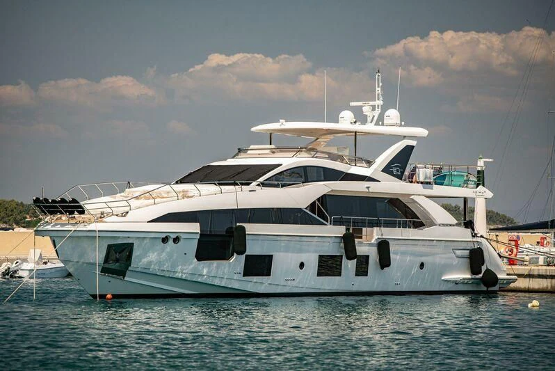 a large white boat in the water aboard TAMUSIA Yacht for Sale
