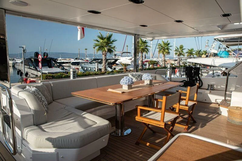 a living room with a couch and a table aboard TAMUSIA Yacht for Sale