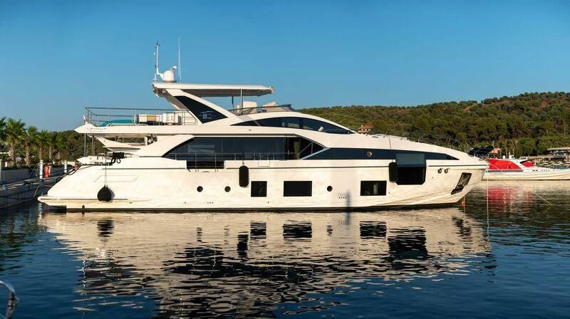 a large white boat on a body of water aboard TAMUSIA Yacht for Sale