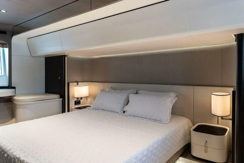a bed with white sheets aboard TAMUSIA Yacht for Sale