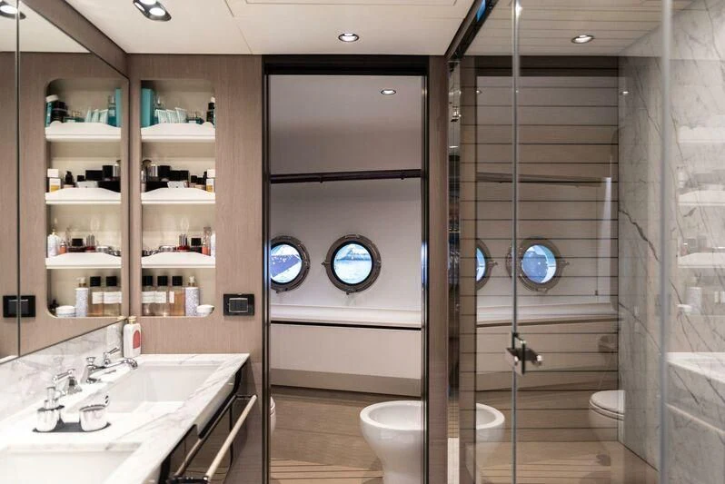 a bathroom with a glass shower aboard TAMUSIA Yacht for Sale