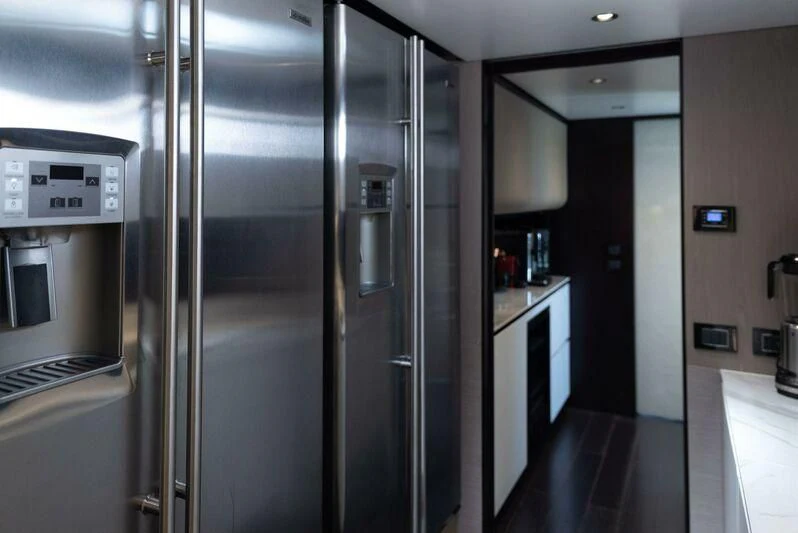 a large kitchen with stainless steel appliances aboard TAMUSIA Yacht for Sale