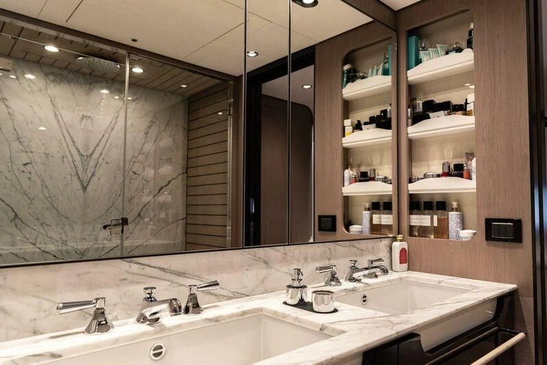 a bathroom with two sinks aboard TAMUSIA Yacht for Sale