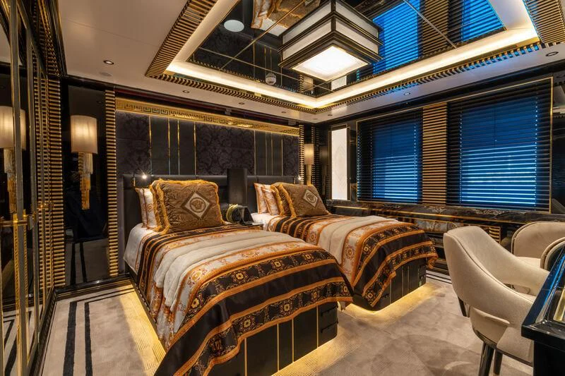 a bedroom with a bed and a large window aboard LEONA Yacht for Sale