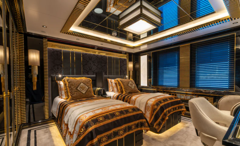 a room with a bed and a large window aboard LEONA Yacht for Sale
