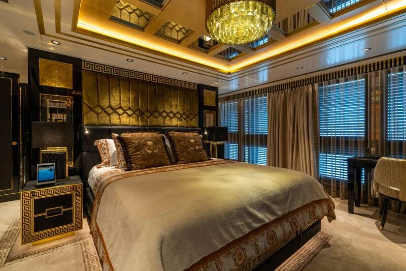 a large bed in a room aboard LEONA Yacht for Sale