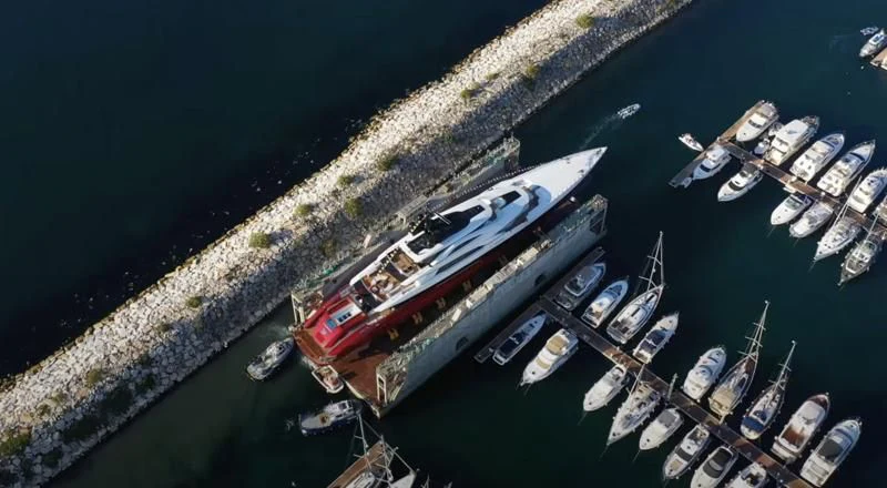 a large ship in the water aboard LEONA Yacht for Sale