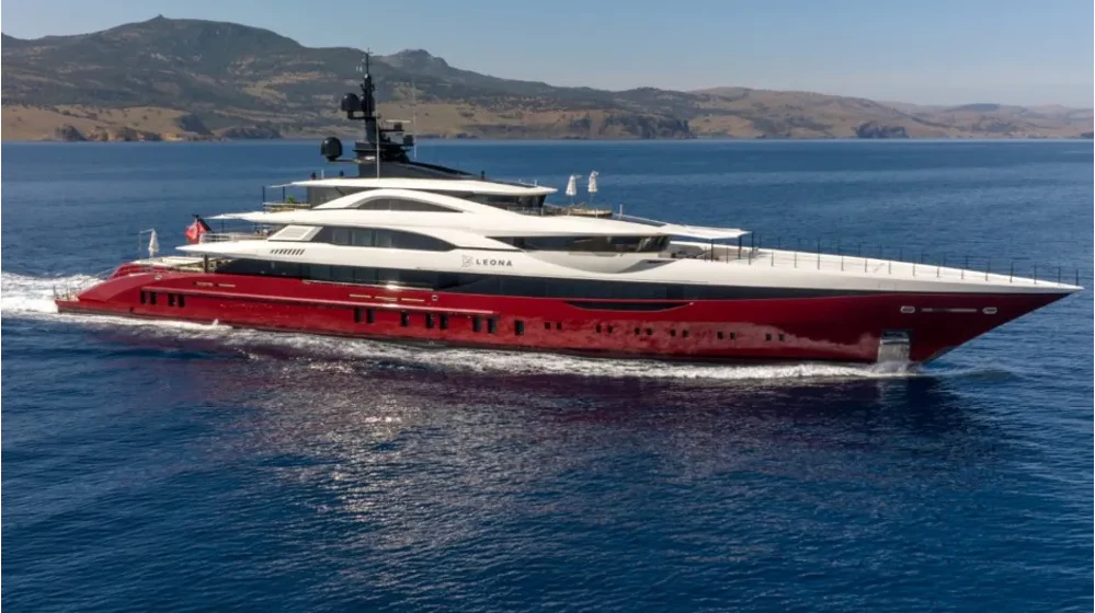 a red and white boat in the water aboard LEONA Yacht for Sale