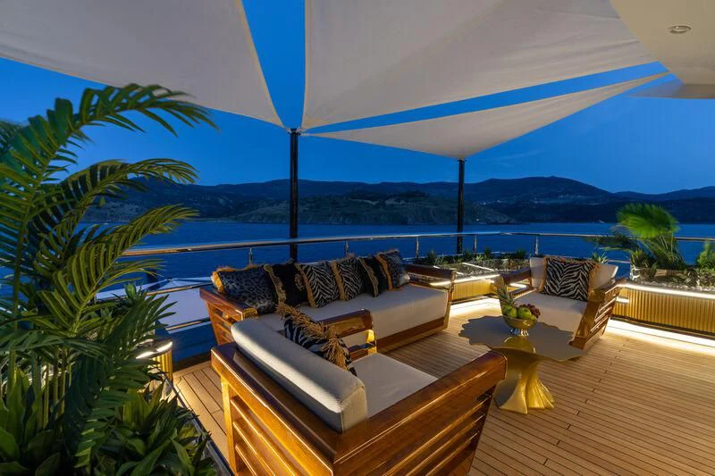 a living room with a large patio aboard LEONA Yacht for Sale