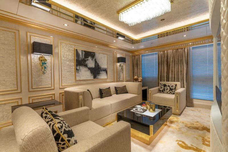 a living room with a couch and a coffee table aboard LEONA Yacht for Sale