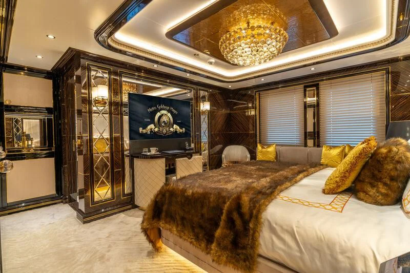 a large bed in a room aboard LEONA Yacht for Sale
