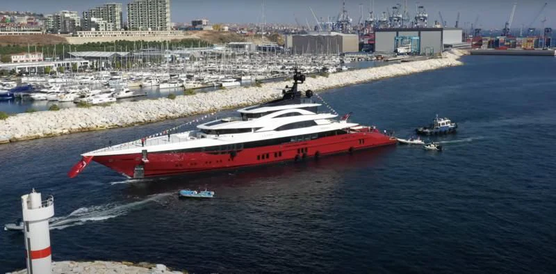 a large ship in the water aboard LEONA Yacht for Sale