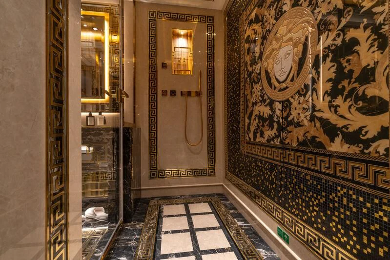a hallway with a gold wall aboard LEONA Yacht for Sale