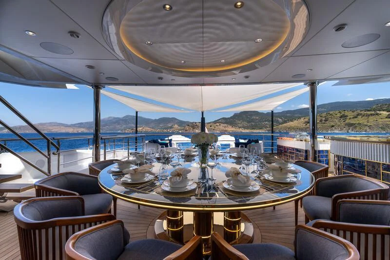 a table set for a dinner aboard LEONA Yacht for Sale