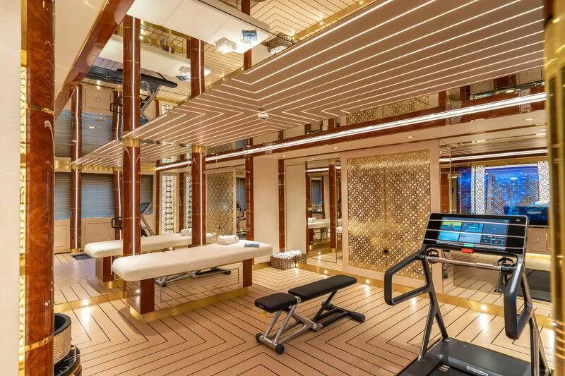 a room with a bench and a table aboard LEONA Yacht for Sale