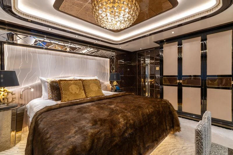 a large bed in a room aboard LEONA Yacht for Sale