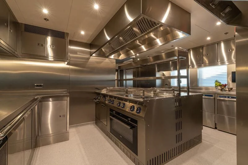 a kitchen with stainless steel appliances aboard LEONA Yacht for Sale