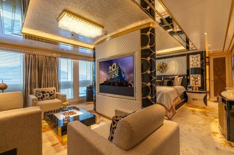 a living room with a large screen aboard LEONA Yacht for Sale