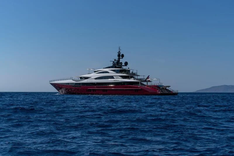 a red and white boat in the water aboard LEONA Yacht for Sale