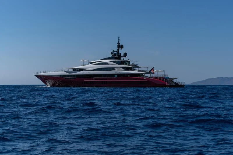 a large red and white boat in the water aboard LEONA Yacht for Sale